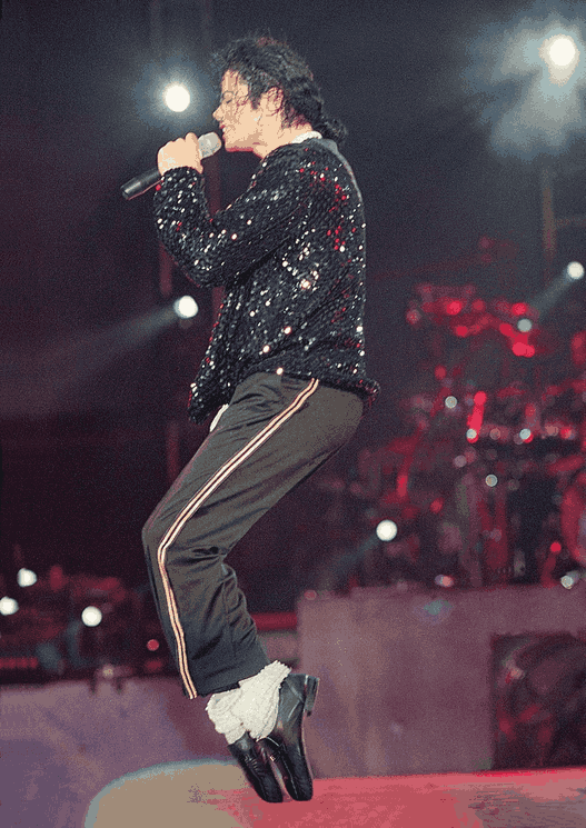 michael-jackson-dancing-on-stage-iconic-black-outfit.png